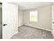 Bedroom featuring new neutral carpet, and large window that provides bright natural light at 2420 Goose Creek Rd, Martinsville, IN 46151