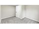 Simple bedroom with soft carpeting, a closed closet door, and neutral paint at 2420 Goose Creek Rd, Martinsville, IN 46151