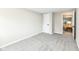 Cozy bedroom with neutral carpeting, and a door leading to the living area at 2420 Goose Creek Rd, Martinsville, IN 46151