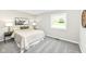 Comfortable bedroom features soft carpet, neutral paint, and a comfortable bed at 2420 Goose Creek Rd, Martinsville, IN 46151