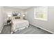 Cozy bedroom with soft carpet, neutral paint, a comfortable bed, side tables and a window view at 2420 Goose Creek Rd, Martinsville, IN 46151