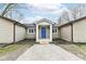 Inviting front entrance features a blue door, stone accents, and a gravel pathway at 2420 Goose Creek Rd, Martinsville, IN 46151