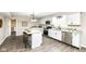 Modern kitchen with white cabinets, stainless steel appliances, and a center island at 2420 Goose Creek Rd, Martinsville, IN 46151