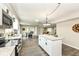 Spacious kitchen features a large island with granite counters and overlooks an adjacent dining area at 2420 Goose Creek Rd, Martinsville, IN 46151