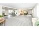 Spacious living room with new carpet adjacent to dining and kitchen at 2420 Goose Creek Rd, Martinsville, IN 46151