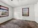 Bedroom featuring two windows and carpeted floors at 2429 N Arsenal Ave, Indianapolis, IN 46218