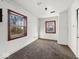 Bedroom features carpeted floors, white walls and trim, and two windows allowing natural light at 2429 N Arsenal Ave, Indianapolis, IN 46218