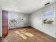 Bedroom featuring two windows and geometric design accent wall at 2429 N Arsenal Ave, Indianapolis, IN 46218