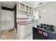 A functional kitchen with vintage cabinets, an electric range, and unique tile flooring at 2429 N Arsenal Ave, Indianapolis, IN 46218