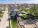 An aerial view of the house shows the neighborhood, mature trees, and foundation project at 310 W Staat St, Fortville, IN 46040