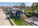 Aerial view of a charming home with a well-manicured lawn, mature trees, and construction site at 310 W Staat St, Fortville, IN 46040