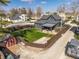 Aerial view highlighting the home, backyard with new construction, and neighborhood surroundings at 310 W Staat St, Fortville, IN 46040