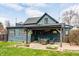 Beautiful backyard featuring a covered patio with seating, a grassy area, and a well-maintained exterior at 310 W Staat St, Fortville, IN 46040