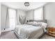 Stylishly decorated bedroom with large bed, patterned linens, and decorative wall hanging at 310 W Staat St, Fortville, IN 46040