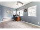 Cozy bedroom featuring neutral carpet, ceiling fan and lots of natural light from the double windows at 310 W Staat St, Fortville, IN 46040