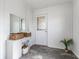 This charming mudroom features modern floors, built-in storage, and bright natural light from the glass door at 310 W Staat St, Fortville, IN 46040
