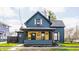 Charming two-story home with a well-manicured lawn and inviting front porch at 310 W Staat St, Fortville, IN 46040