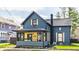 Charming home with a welcoming front porch, well-maintained lawn, and lovely curb appeal at 310 W Staat St, Fortville, IN 46040