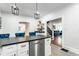 Open-concept kitchen with stainless steel appliances and a breakfast bar, ideal for entertaining at 310 W Staat St, Fortville, IN 46040