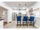 Well-lit kitchen with stainless steel appliances and a sleek breakfast bar for casual dining at 310 W Staat St, Fortville, IN 46040