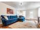 Comfortable living room with natural light and stylish blue sectional sofa at 310 W Staat St, Fortville, IN 46040