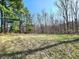 Expansive backyard showcasing mature trees and lush greenery, offering privacy and a natural setting at 3395 State Road 44, Martinsville, IN 46151