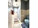 Bathroom featuring a blue toilet, hexagon tiles, and a walk-in shower at 3395 State Road 44, Martinsville, IN 46151