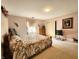 Bedroom features a floral bedspread, classic dresser, and wall art at 3395 State Road 44, Martinsville, IN 46151