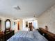 Expansive bedroom with vintage dressers, rocking chair, and decorative details at 3395 State Road 44, Martinsville, IN 46151
