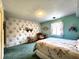 Cozy bedroom with green carpet, floral wallpaper, and vintage furniture accents at 3395 State Road 44, Martinsville, IN 46151