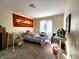 Bedroom features a bed with an ironing board and a red FMF banner at 3395 State Road 44, Martinsville, IN 46151