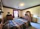 Traditional bedroom with border, natural light, and classic wood furniture at 3395 State Road 44, Martinsville, IN 46151