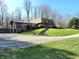 Charming home with a stone facade, screened in porch, and well-manicured front yard at 3395 State Road 44, Martinsville, IN 46151