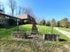 Home exterior with stone details, a long stairway and mature landscaping at 3395 State Road 44, Martinsville, IN 46151