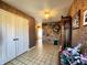 Hallway showcasing tile floors, stone accent wall, and chandelier lighting at 3395 State Road 44, Martinsville, IN 46151