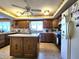 Functional kitchen with central island, wood cabinets, and stainless steel appliances at 3395 State Road 44, Martinsville, IN 46151