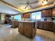 Functional kitchen with central island, wood cabinets, and modern appliances at 3395 State Road 44, Martinsville, IN 46151