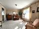 Living room with patterned wallpaper, neutral carpet, and natural light from the windows at 3395 State Road 44, Martinsville, IN 46151