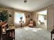 Inviting living room with patterned wallpaper, neutral carpet, and a cozy sitting area at 3395 State Road 44, Martinsville, IN 46151