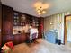 Office features built-in shelves, patterned wallpaper, and a work area at 3395 State Road 44, Martinsville, IN 46151