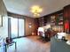 Office with dark wood built-ins, a large window, and patterned wallpaper at 3395 State Road 44, Martinsville, IN 46151