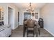 Inviting dining room featuring a rustic wooden table and contemporary chandelier lighting at 3636 N Chester Ave, Indianapolis, IN 46218