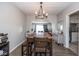 A cozy dining room with a wooden table, chandelier lighting, and an open floor plan at 3636 N Chester Ave, Indianapolis, IN 46218
