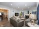 Bright living room featuring a fireplace, couches, and a flat screen TV with an open floor plan at 3636 N Chester Ave, Indianapolis, IN 46218