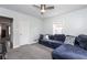 Inviting living room featuring a comfortable blue sofa and neutral carpet, creating a cozy space at 3636 N Chester Ave, Indianapolis, IN 46218