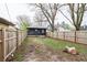 Fenced backyard with a gravel parking area at 3704 Graceland Ave, Indianapolis, IN 46208