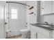 Bathroom featuring a shower/tub combo, vanity with sink, and updated fixtures at 3704 Graceland Ave, Indianapolis, IN 46208