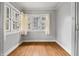 Bedroom with lots of natural light, hardwood floors, and closet at 3704 Graceland Ave, Indianapolis, IN 46208