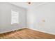 Bright bedroom with wood floors, fresh paint, and lots of natural light at 3704 Graceland Ave, Indianapolis, IN 46208