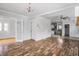 Bright and airy living room with hardwood floors and neutral paint at 3704 Graceland Ave, Indianapolis, IN 46208